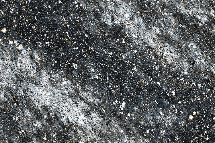 A textured, speckled granite stone speckled granite stone