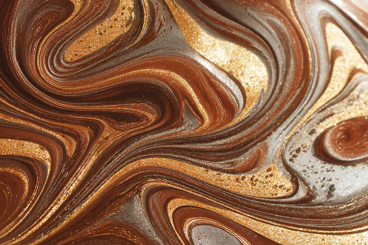A close-up view of a marbled surface swirling brown & gold