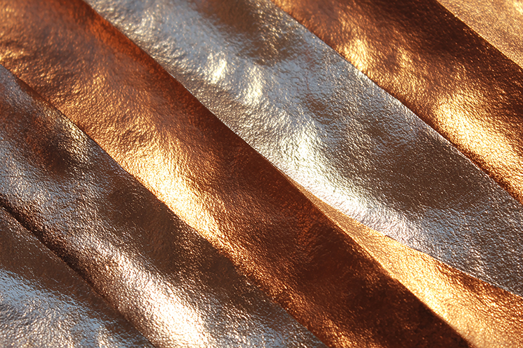 A luxurious metallic fabric with a shiny surface