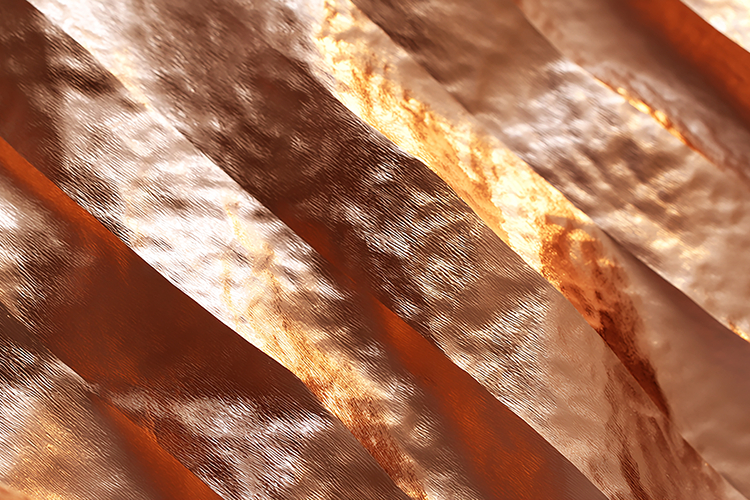 A luxurious rose gold fabric folds and textutes