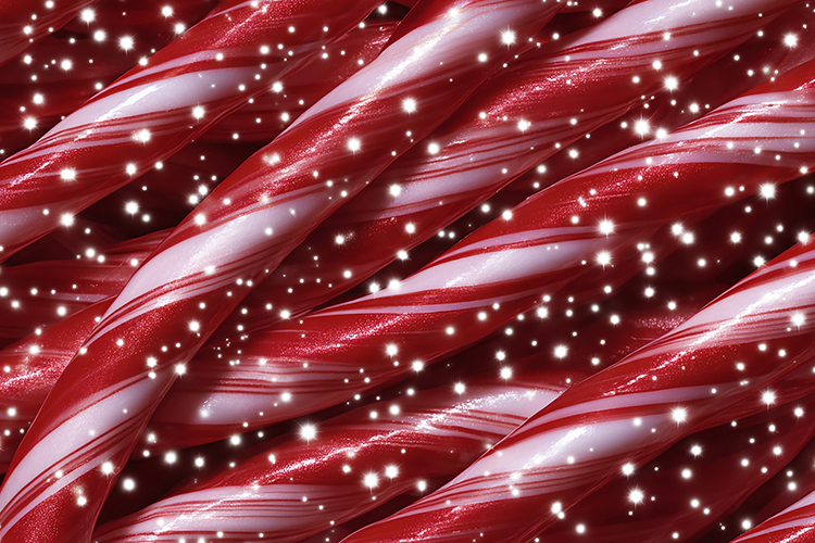 A festive background of red and white candy canes with spark