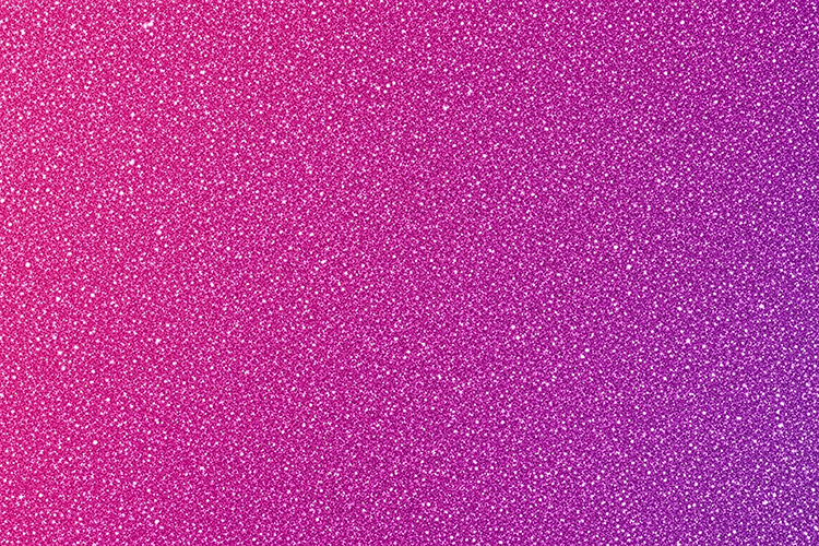 Pink and purple glittery background with a sparkling texture