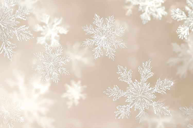 A delicate pattern of white snowflakes on a soft beige