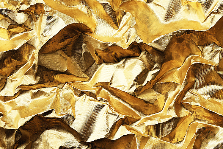 A crumpled gold foil paper texture