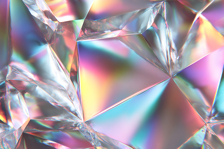 A crystal with a colorful, iridescent sheen reflecting light