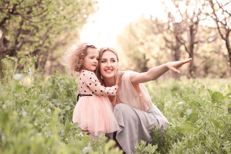 Mother with daughter outdoors