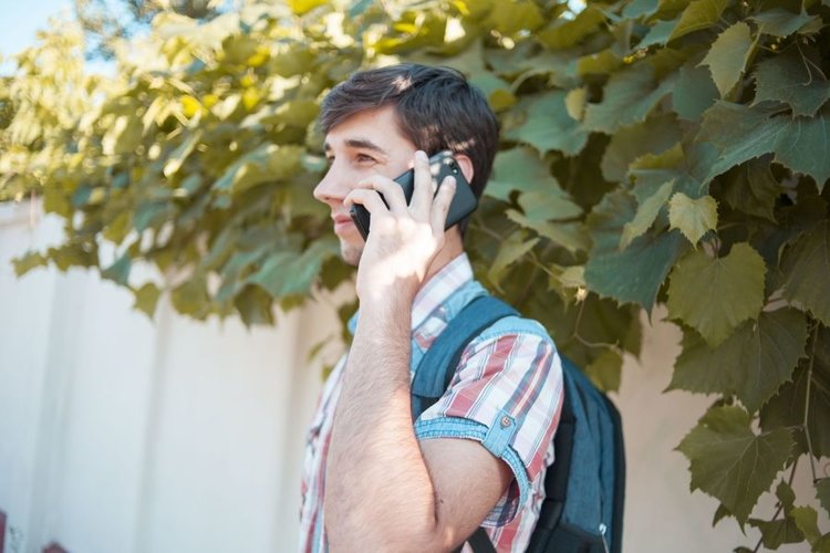 Young man walks in the city example image 1