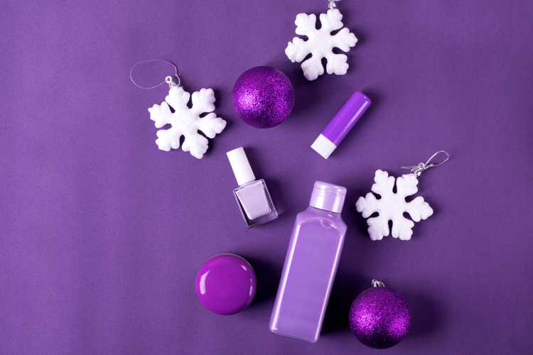 Purple winter cosmetics flat lay