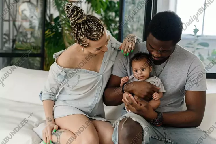 Multiethnic family relaxing sitting on a comfortable sofa