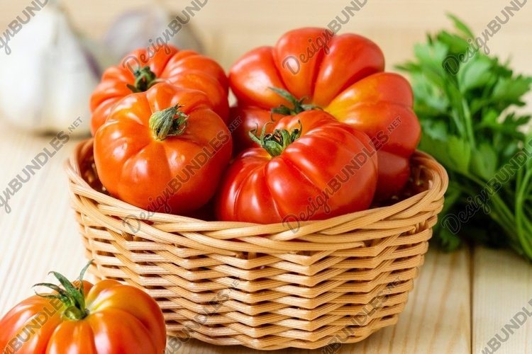 Ripe red tomatoes in basket example image 1