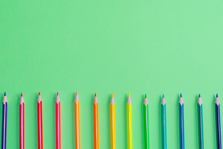 School and office supplies on office table, green background