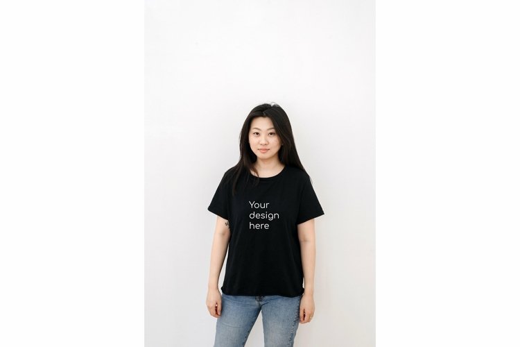 Asian woman in a black t shirt on a white background example image 1