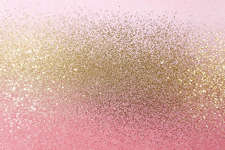 Pink and gold glittery background with a sparkling texture
