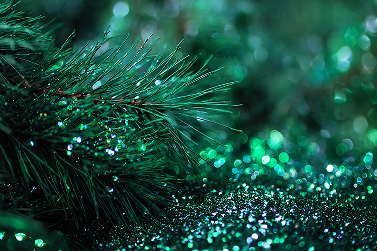 Pine tree branch with sparkling green glitter