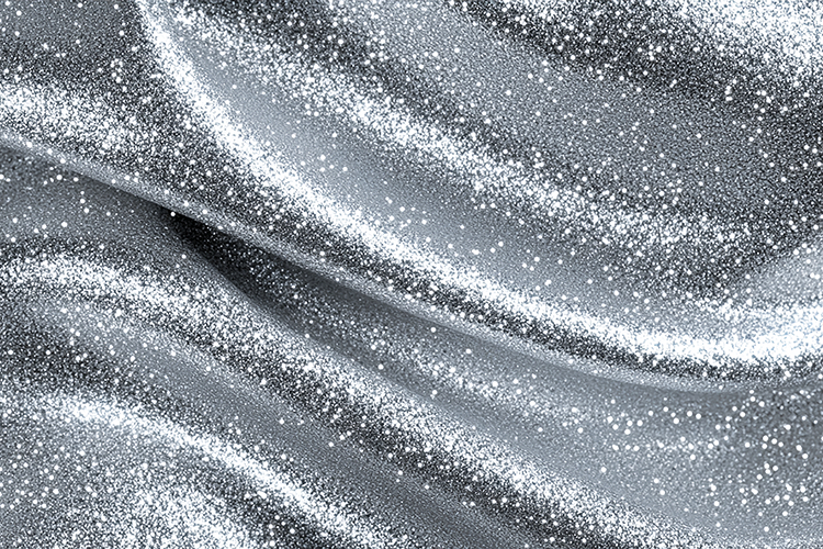 Sparkling silver fabric with glittery texture and folds