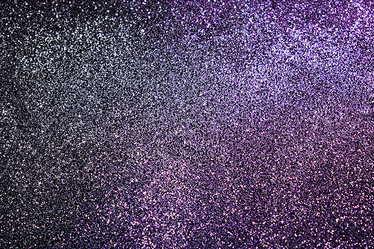 Purple and black glitter background with sparkling particles