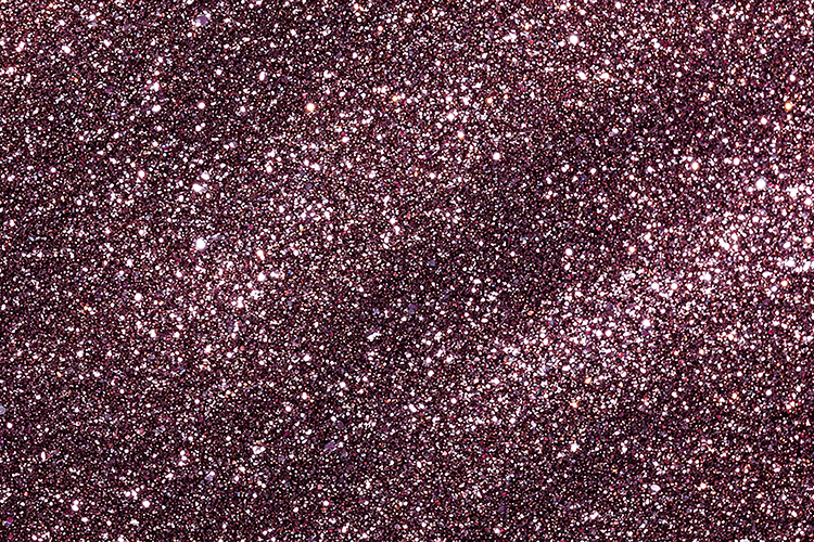 Purple glitter background with sparkling white specks