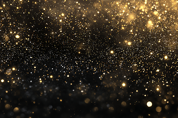 A dark background with gold glitter and sparkles scattered