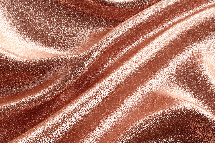 Rose gold fabric with a shiny and smooth texture