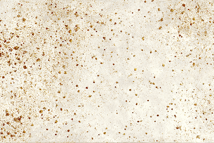 A beige surface with small brown and gold speckles