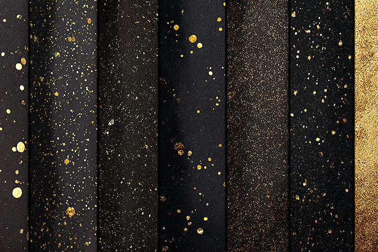 A collection of black and gold textured papers with speckled
