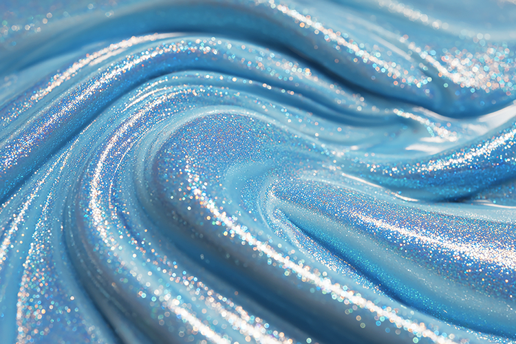 Sparkly blue cosmetic product with a smooth & shiny texture