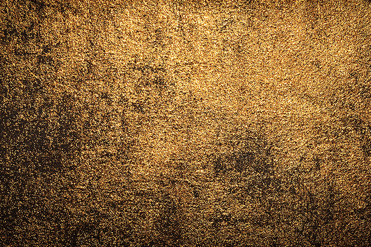 Textured golden brown surface with a rough grainy background