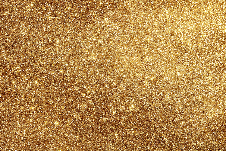A gold glitter background with sparkles and shine