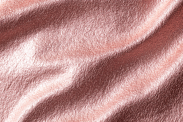 Luxurious rose gold fabric with a smooth and shiny texture