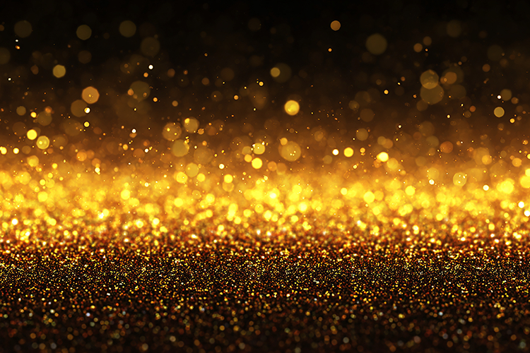 Golden glitter background with sparkling lights