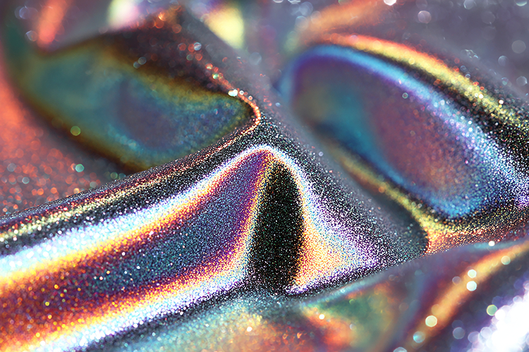 Iridescent surface with shimmering colors and textures