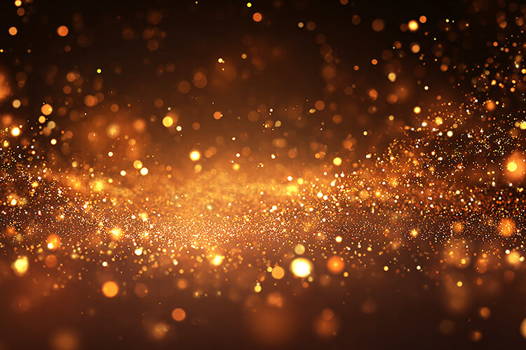 Background filled with sparkling golden particles and light