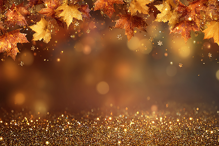 Warm and cozy autumn background with golden leaves & sparkle