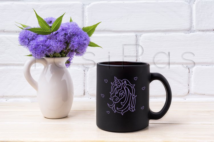 Black coffee mug mockup with blue Ageratum in pitcher example image 1