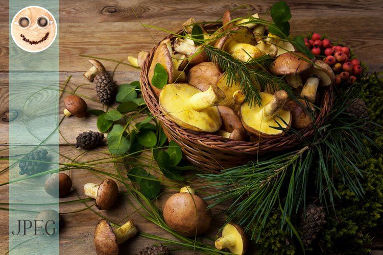 Wicker basket with mushrooms and berries, close up.