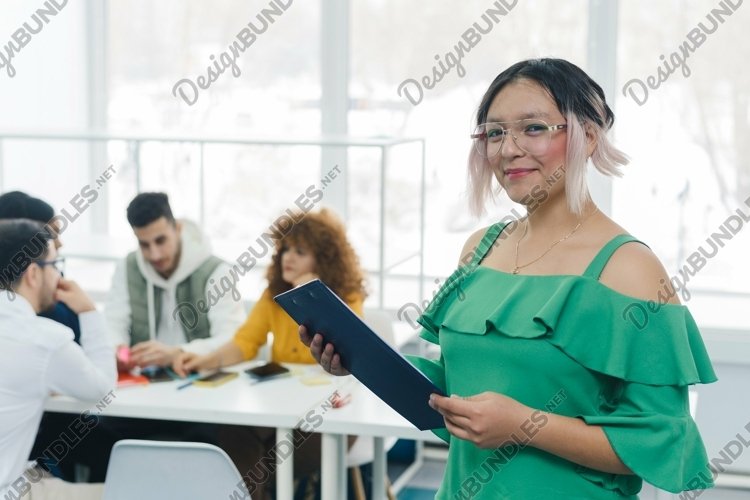 Millennial female start work in the office example image 1