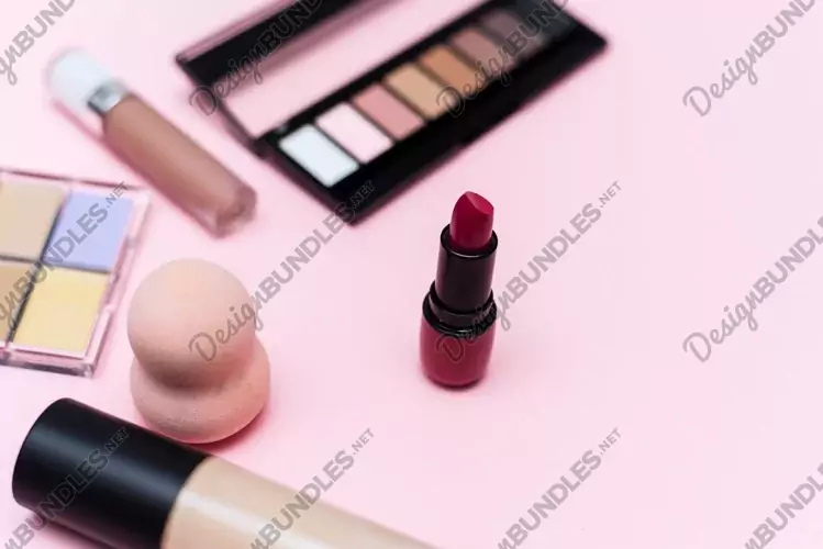 Makeup products and decorative cosmetics on color background