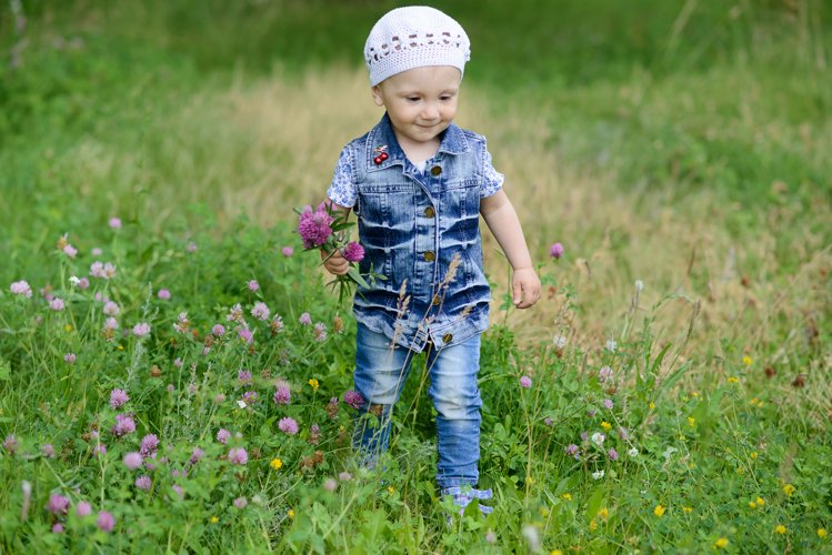 Cute baby girl on a walk in the Park