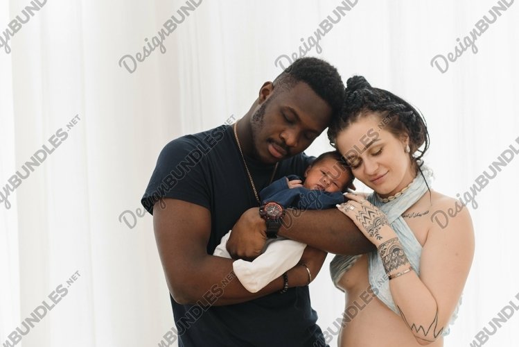 Happy multiracial mother, father and little child example image 1