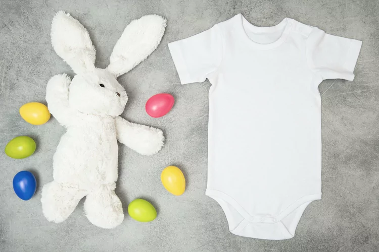 Baby Bodysuit mockup Easter bunny colored eggs stock photo