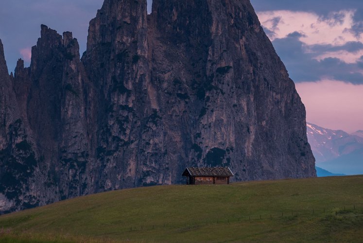 Cottages at Alpe di Siusi at sunrise in the Dolomites example image 1