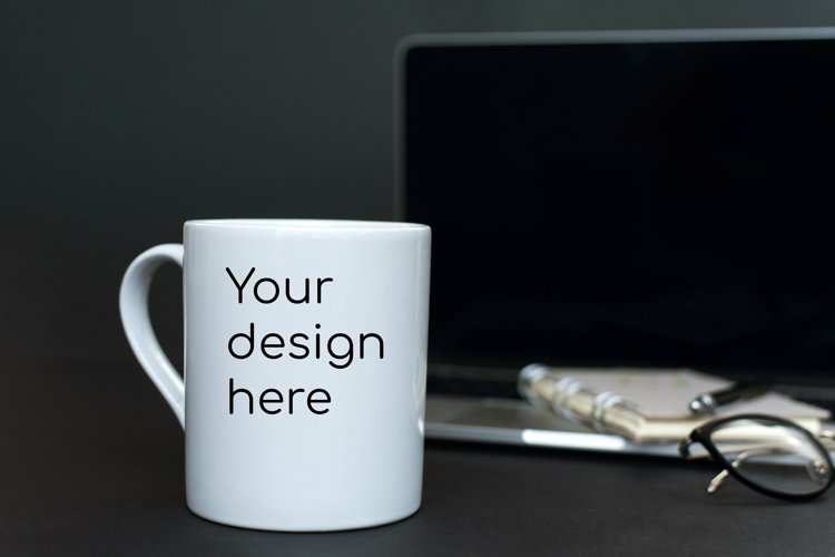 Mockup on a mug in a dark office example image 1