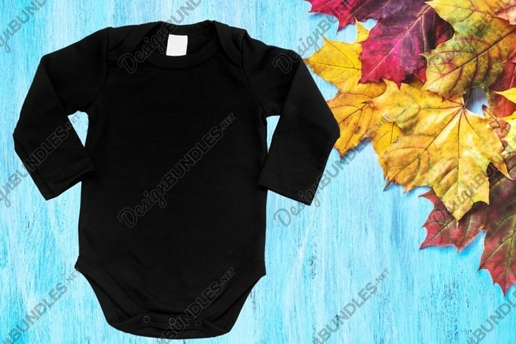 Black baby bodysuit mockup on wood blue background