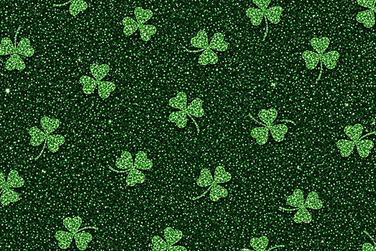 Green glittery background with scattered shamrocks