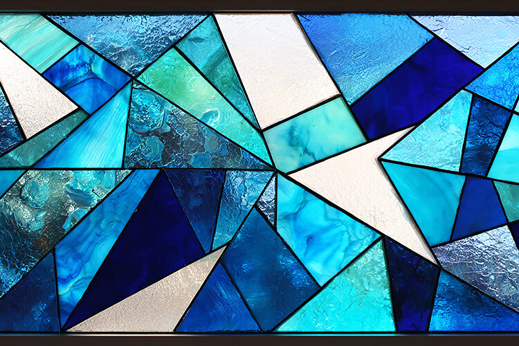 A vibrant stained glass window with geometric shapes
