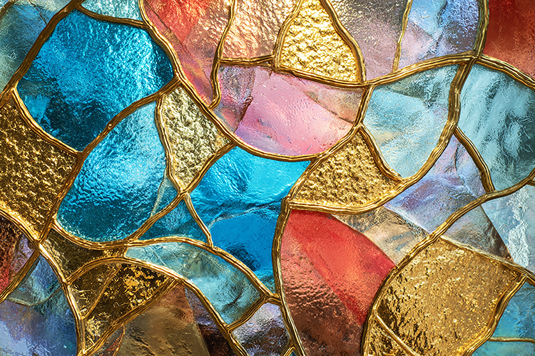 A colorful stained glass window with gold accents