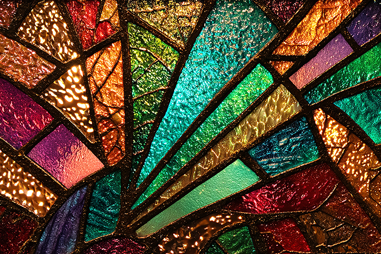 A vibrant stained glass window with colorful panes