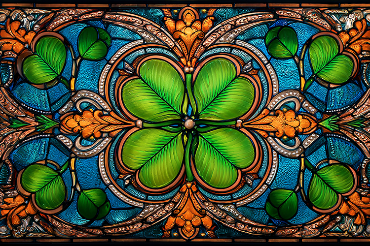 A vibrant stained glass featuring a large green clover