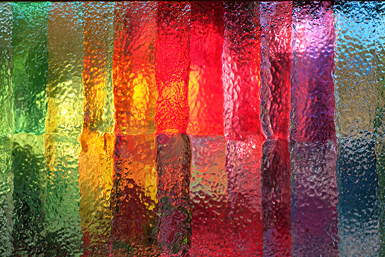 A colorful abstract artwork with textured glass