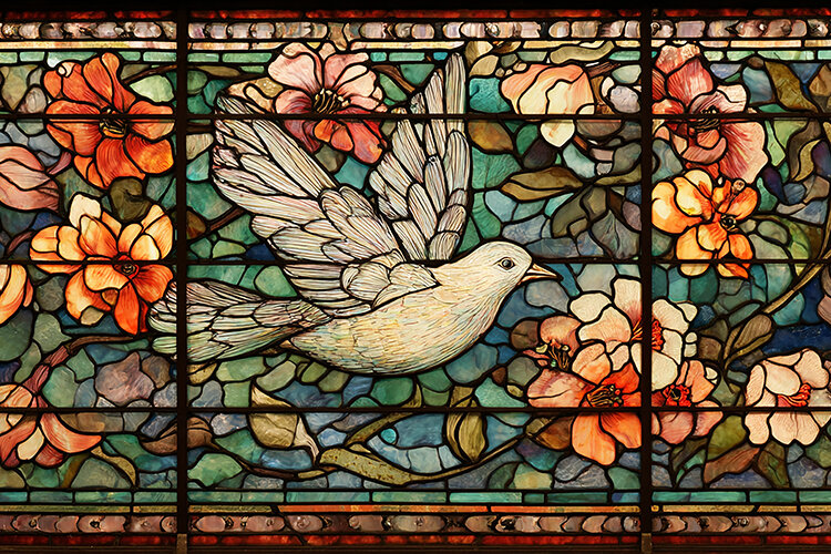 A beautiful stained glass window with a dove and flowers